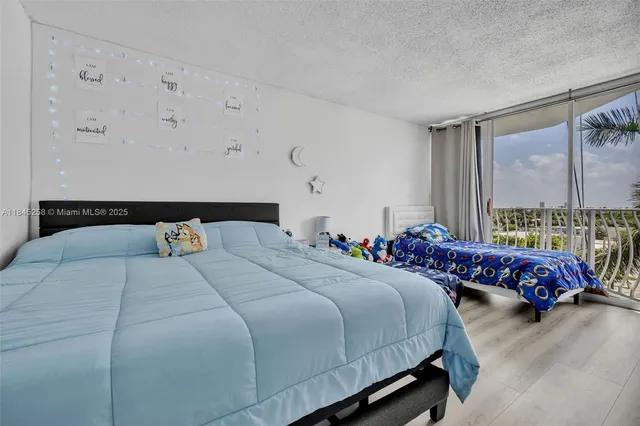 a bedroom with bed and windows