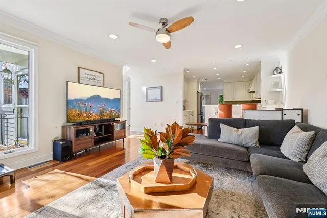 a living room with fireplace furniture and a flat screen tv