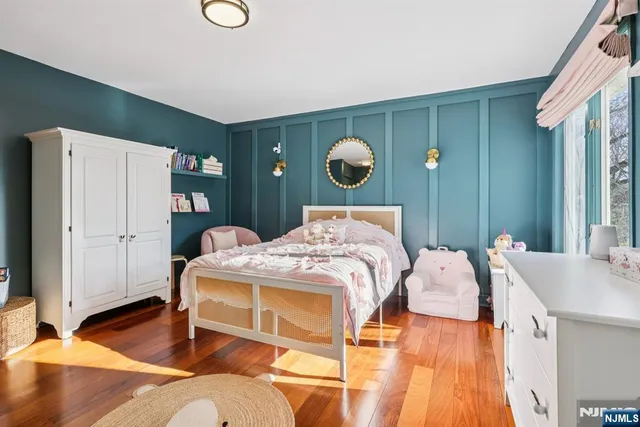 a bedroom with a bed and cabinets