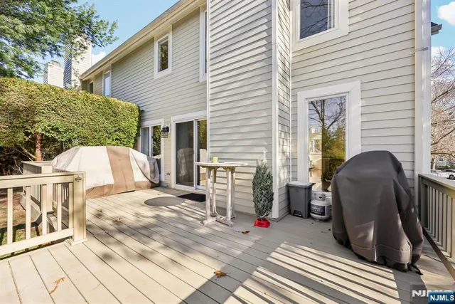 a view of a patio with a table and chairs and wooden floor