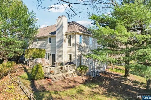a view of a brick building next to a yard