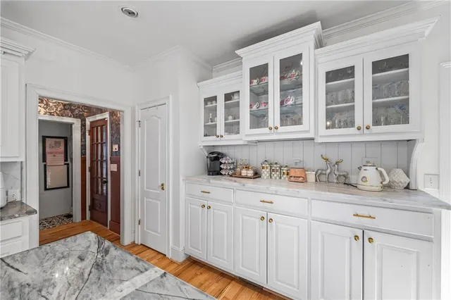 a kitchen with stainless steel appliances granite countertop a sink and cabinets