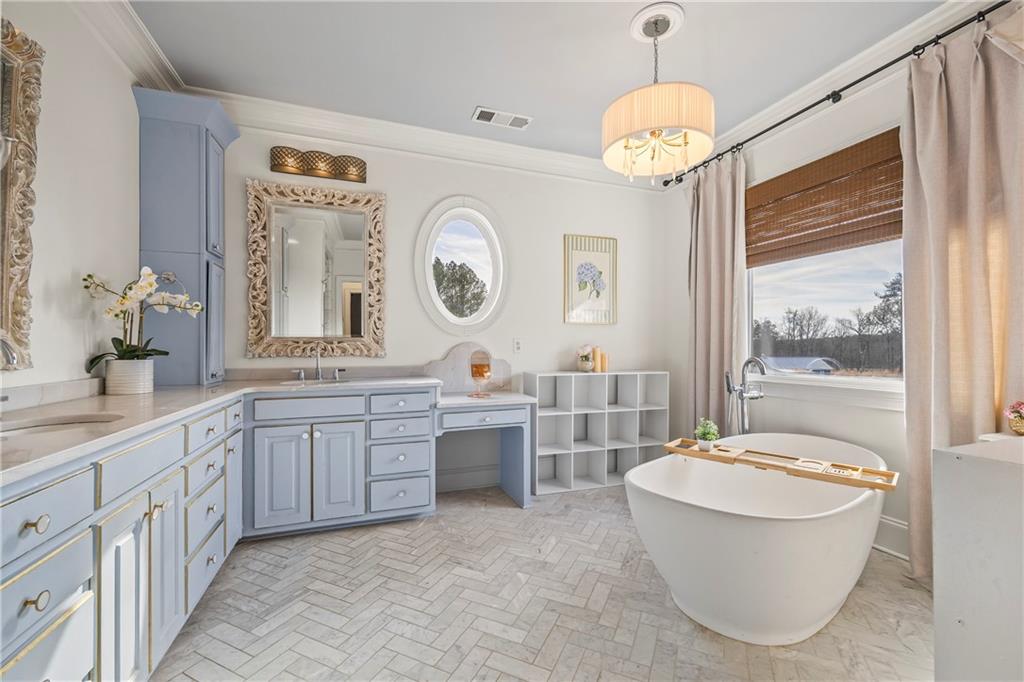2668 New Hope Road Dacula, GA 30019 - Photo 19 of 65 a bathroom with a granite countertop sink mirror and a large window