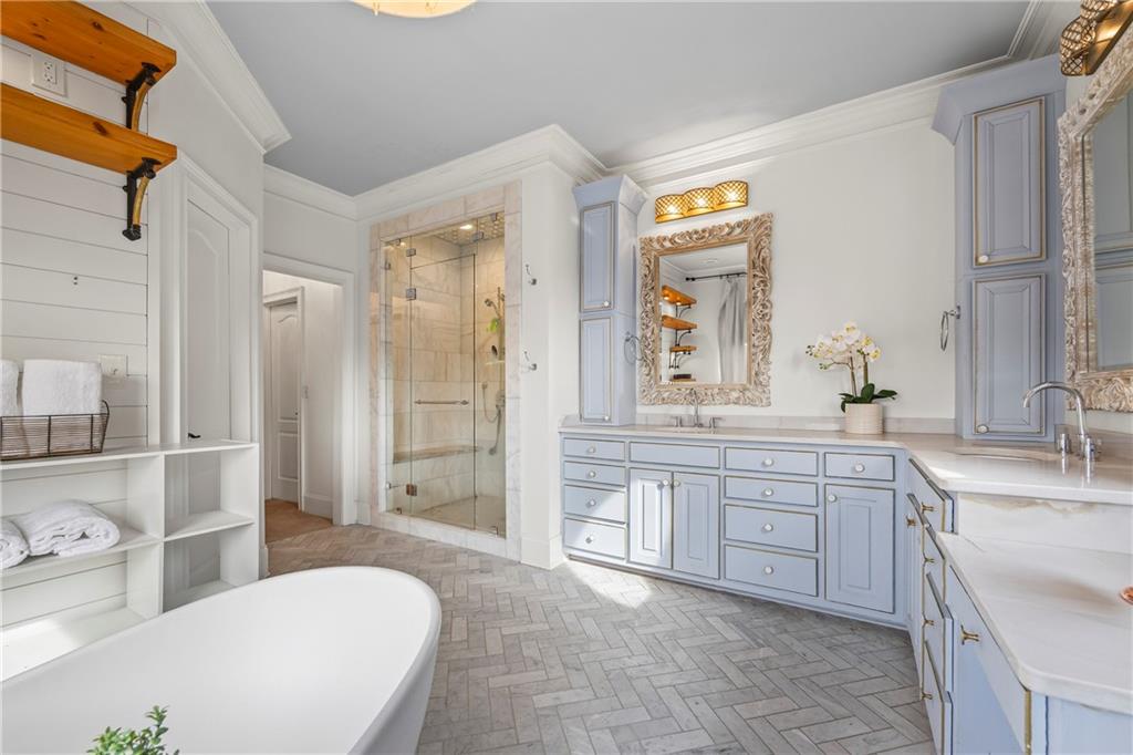 2668 New Hope Road Dacula, GA 30019 - Photo 21 of 65 a spacious bathroom with a shower a sink and a bathtub