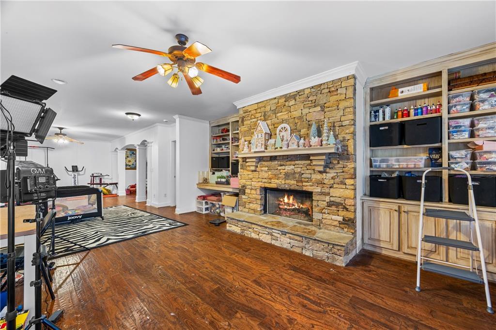 2668 New Hope Road Dacula, GA 30019 - Photo 35 of 65 a living room with furniture a fireplace and a flat screen tv