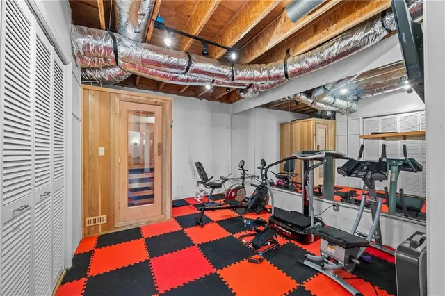 a bathroom with a granite countertop sink a toilet and a mirror