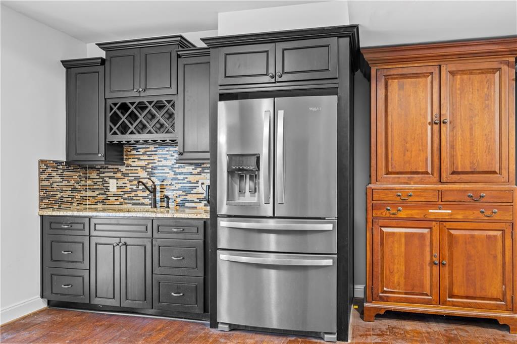 2668 New Hope Road Dacula, GA 30019 - Photo 40 of 65 a kitchen with stainless steel appliances granite countertop a refrigerator and a stove