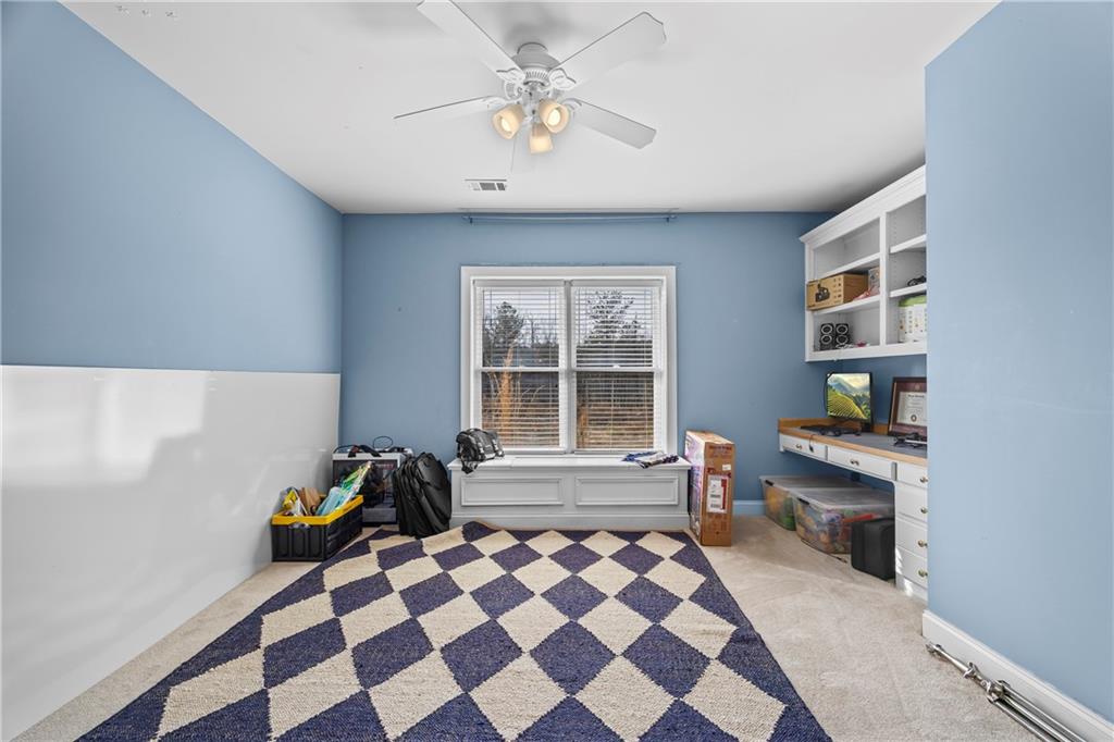 2668 New Hope Road Dacula, GA 30019 - Photo 41 of 65 a view of a workspace with furniture and a window