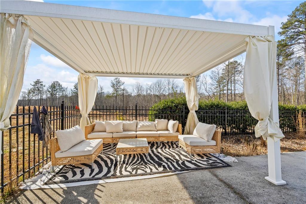 2668 New Hope Road Dacula, GA 30019 - Photo 50 of 65 a living room with furniture and a large window