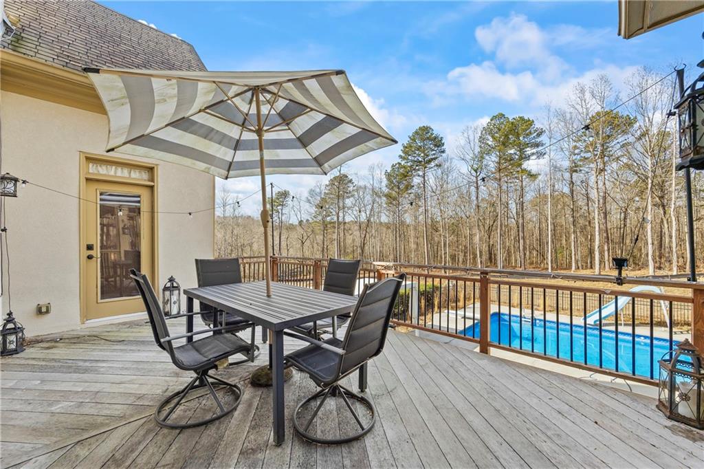 2668 New Hope Road Dacula, GA 30019 - Photo 53 of 65 a view of a chairs and table on the deck