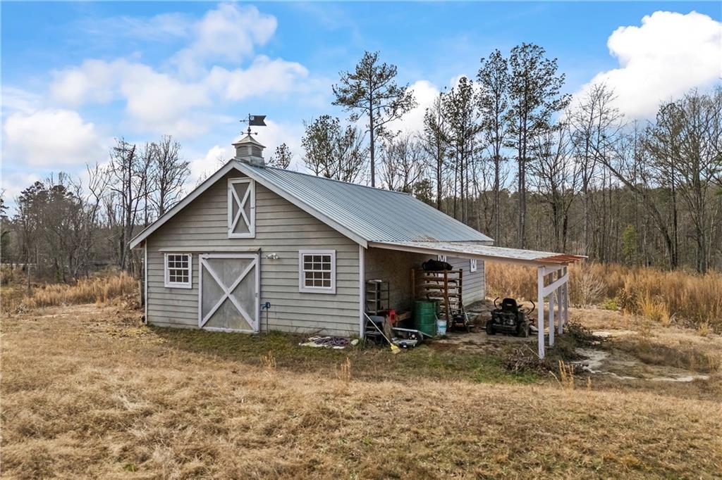 2668 New Hope Road Dacula, GA 30019 - Photo 60 of 65 a view of a house with a yard