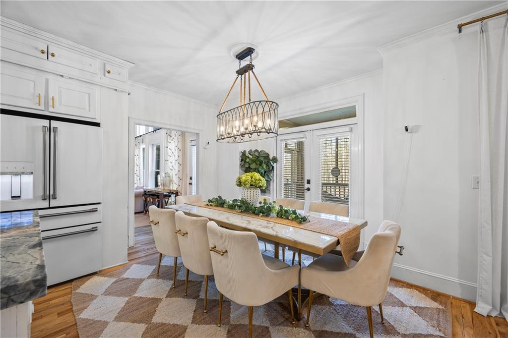 2668 New Hope Road Dacula, GA 30019 - Photo 8 of 65 a view of a dining room with furniture and wooden floor