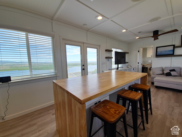900 Altamont Road Evanston, WY 82930 - Photo 26 of 27 Kitchen featuring wood counters, french doors, light wood-style flooring, a ceiling fan, and open floor plan