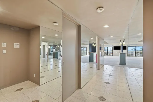 a view of a kitchen with furniture and large window