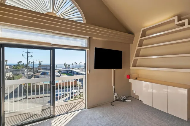 a view of an empty room with a fireplace