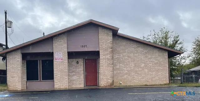 a front view of a house with garage
