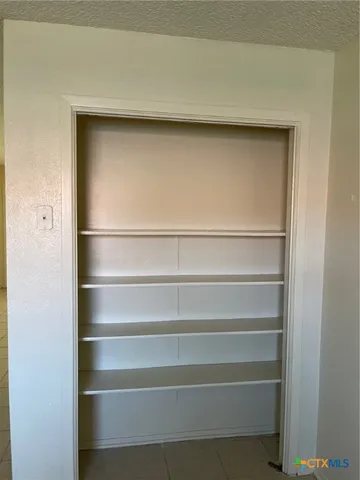 a kitchen with a sink and a refrigerator