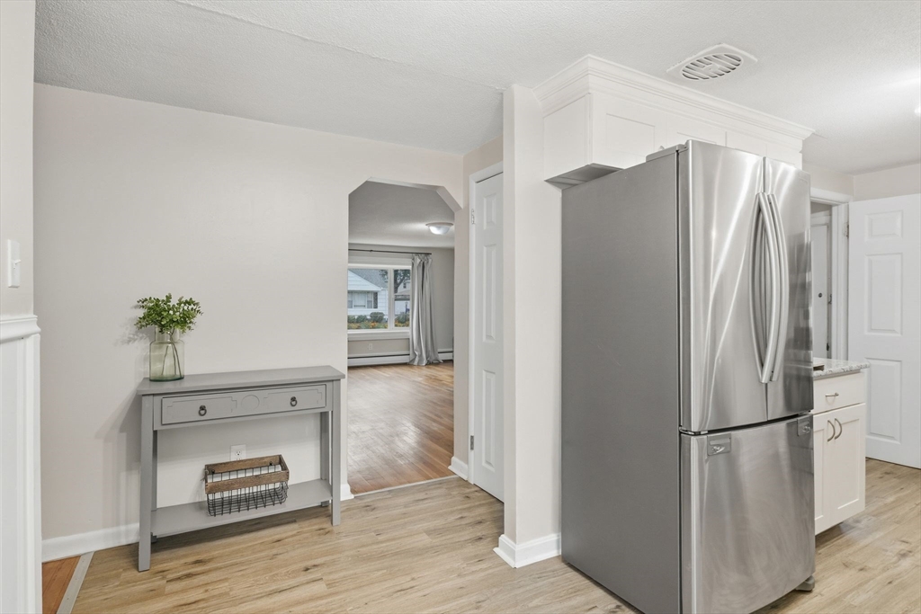 150 Drexel Street Springfield, MA 01104 - Photo 15 of 27 a kitchen with a refrigerator and a stove