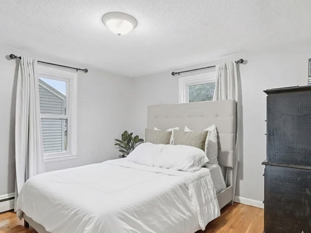 150 Drexel Street Springfield, MA 01104 - Photo 17 of 27 a bedroom with a bed and a window