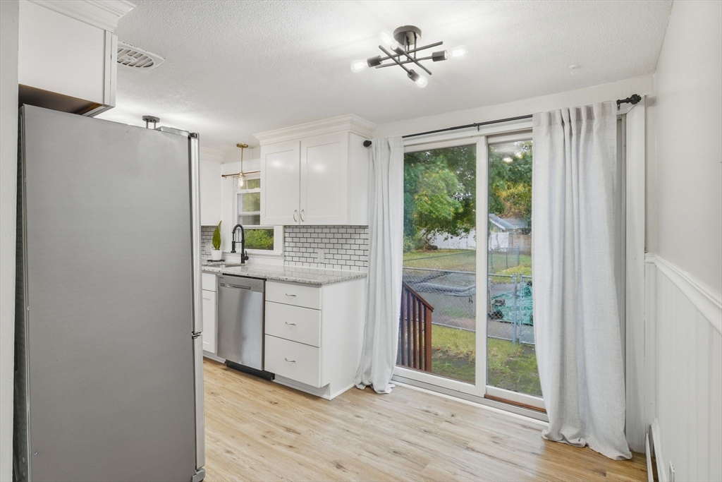 150 Drexel Street Springfield, MA 01104 - Photo 19 of 27 a kitchen with a refrigerator and white doors