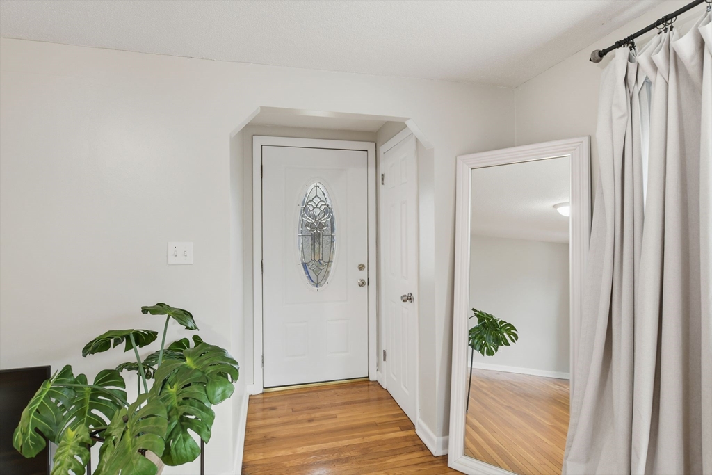 150 Drexel Street Springfield, MA 01104 - Photo 5 of 27 a view of a hallway with wooden door