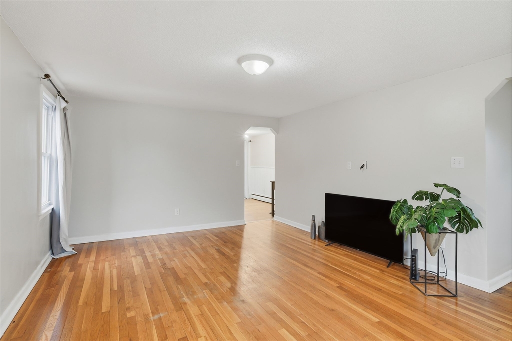 150 Drexel Street Springfield, MA 01104 - Photo 8 of 27 a view of a room with wooden floor and potted plant