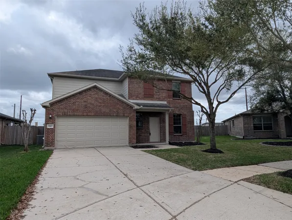 an empty room with wooden floor & closet area