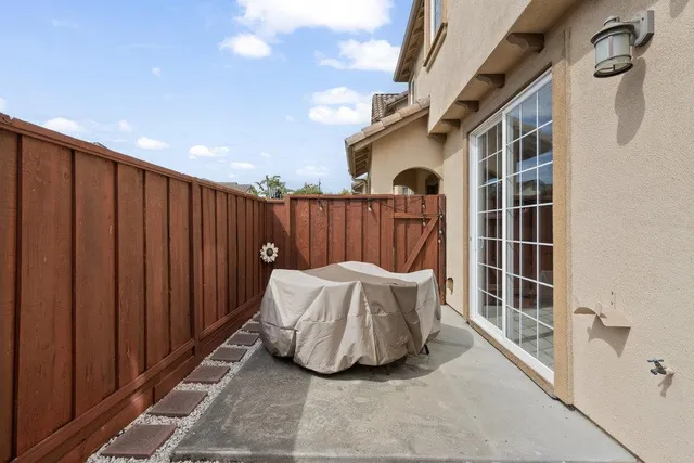a view of a two chairs in the balcony