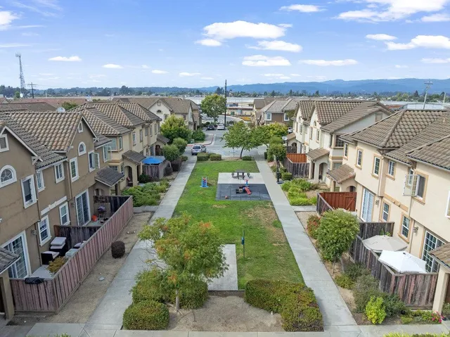 a view of a city with lawn chairs