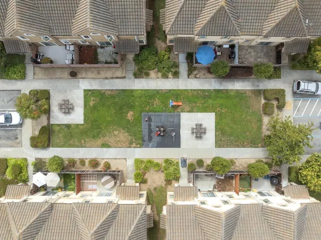 an aerial view of a house with a lake view