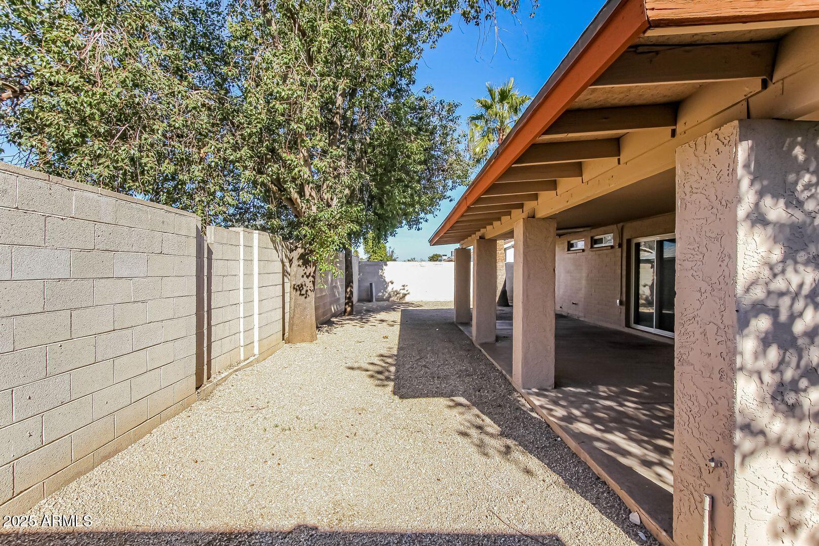 4610 North 75th Drive Phoenix, AZ 85033 - Photo 13 of 14 a view of a house with a patio