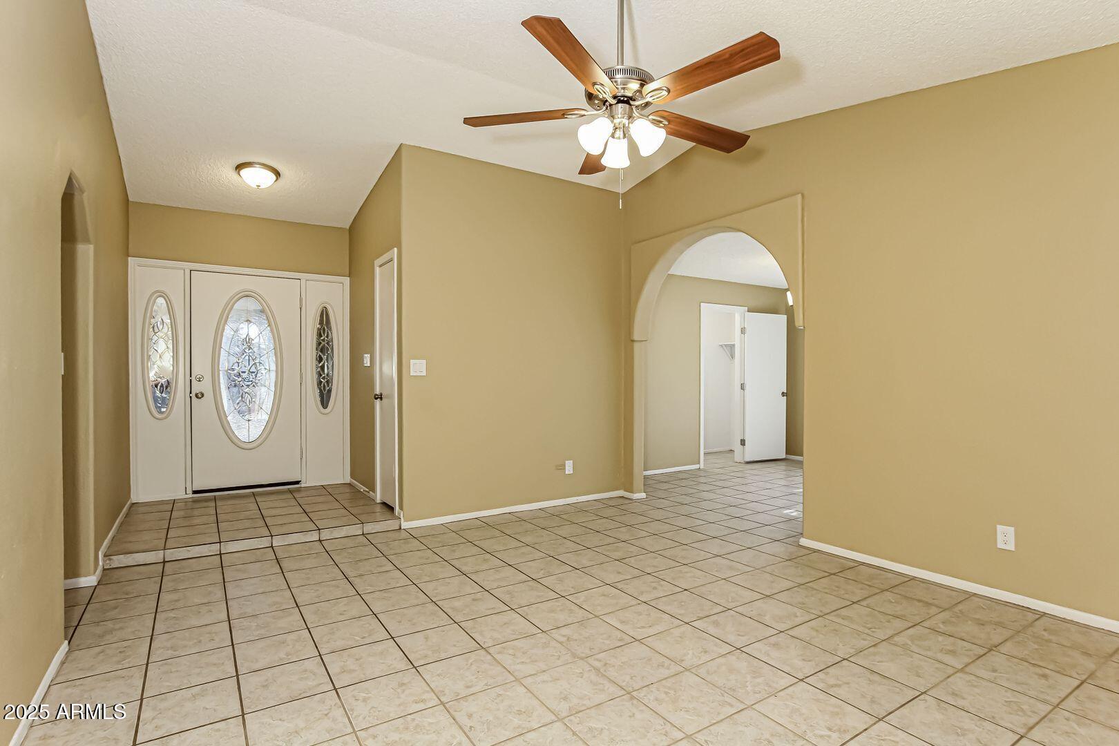 4610 North 75th Drive Phoenix, AZ 85033 - Photo 2 of 14 a view of a hallway with wooden floor