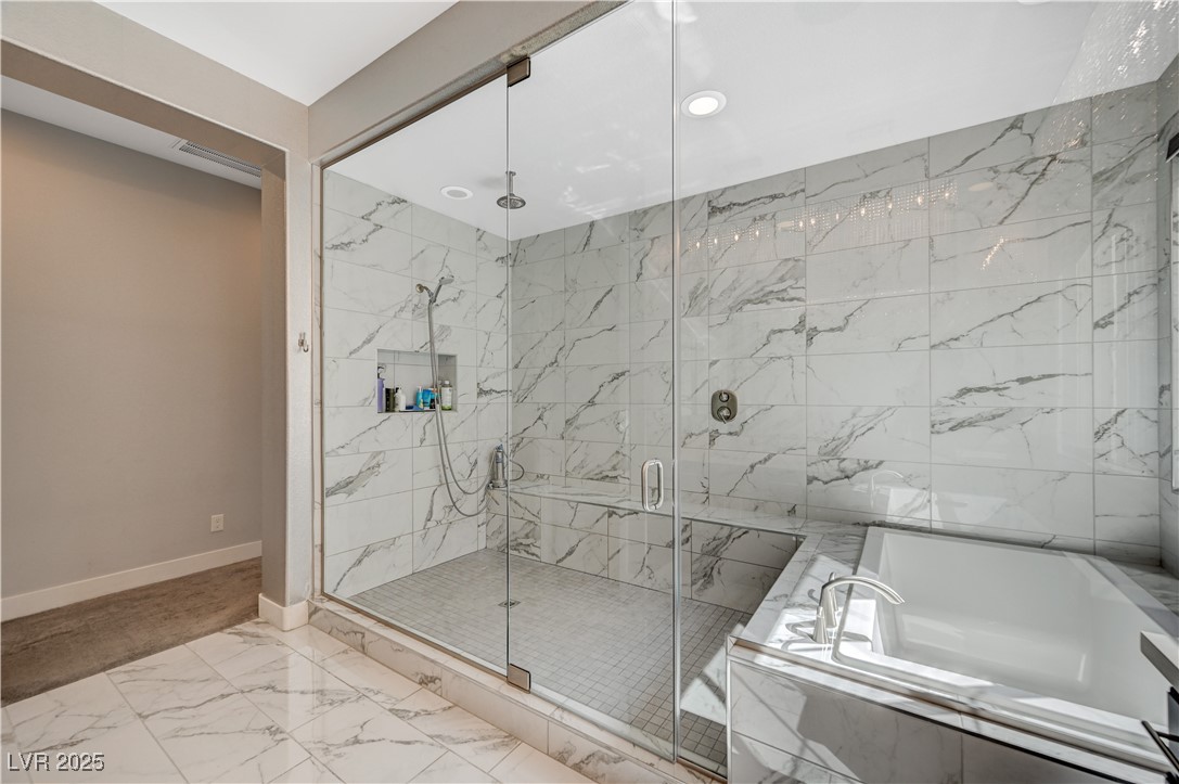 3943 Reyes Avenue Las Vegas, NV 89141 - Photo 32 of 93 Bathroom with a bath, light marble finish floors, a marble finish shower, and recessed lighting