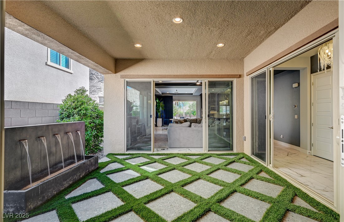 3943 Reyes Avenue Las Vegas, NV 89141 - Photo 46 of 93 View of exterior entry featuring stucco siding and a patio area