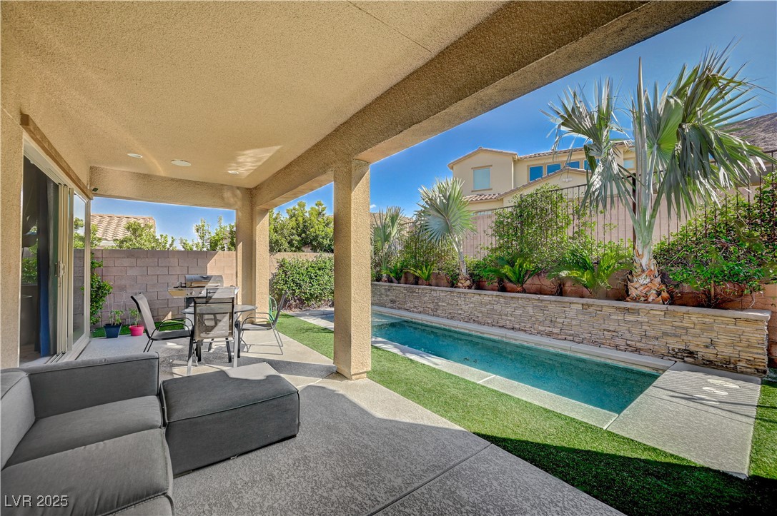 3943 Reyes Avenue Las Vegas, NV 89141 - Photo 50 of 93 Fenced backyard with a patio