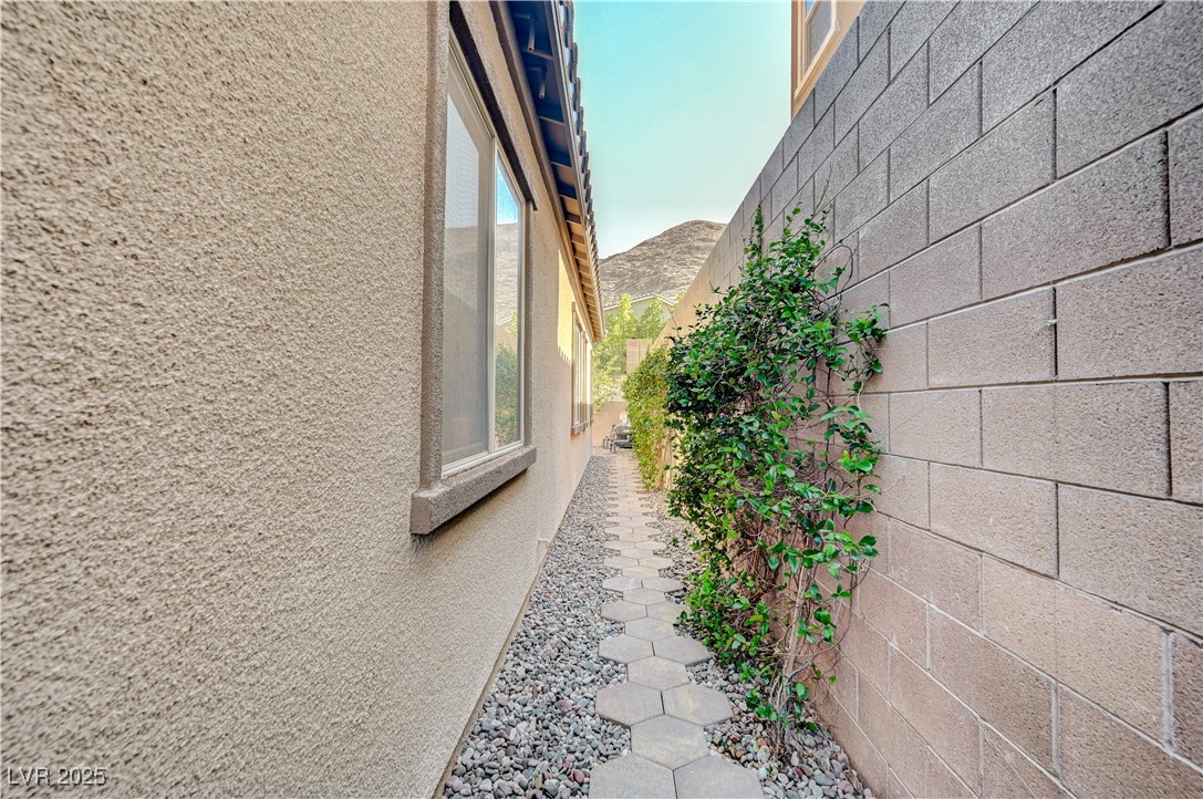 3943 Reyes Avenue Las Vegas, NV 89141 - Photo 58 of 93 View of property exterior featuring stucco siding