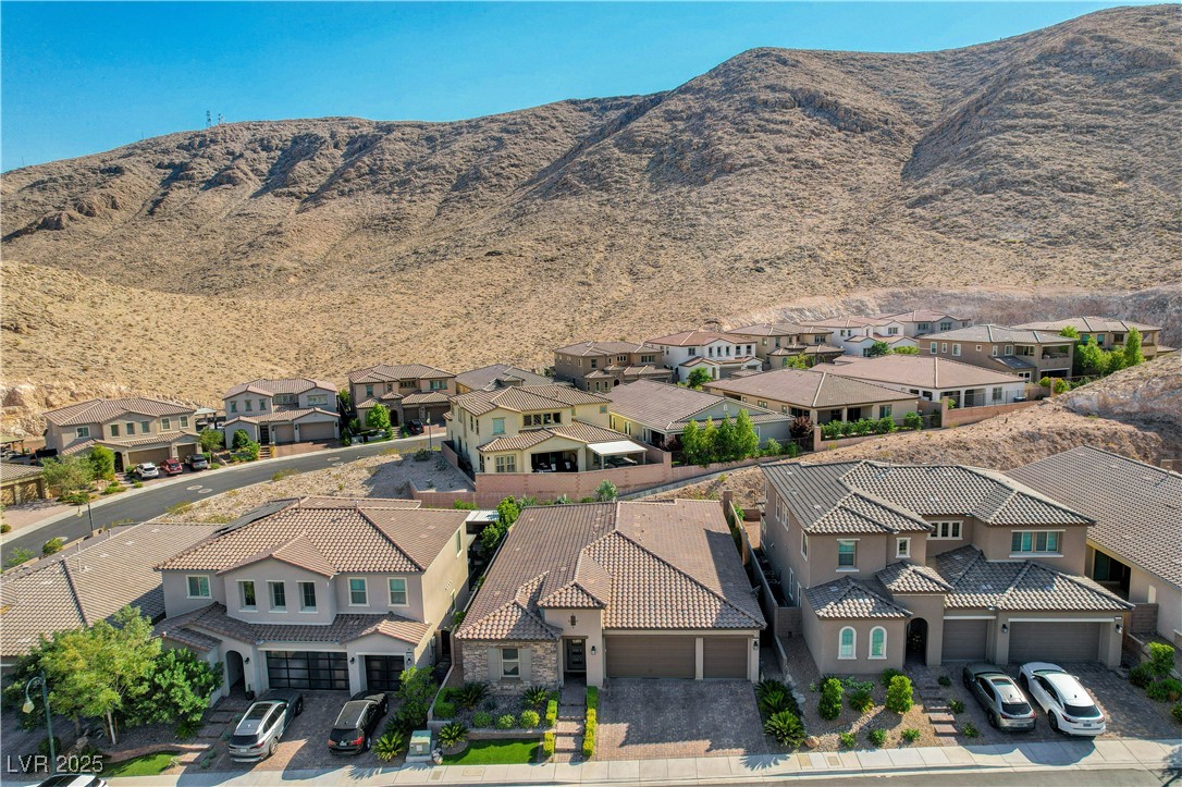 3943 Reyes Avenue Las Vegas, NV 89141 - Photo 60 of 93 Aerial perspective of suburban area featuring a mountain backdrop