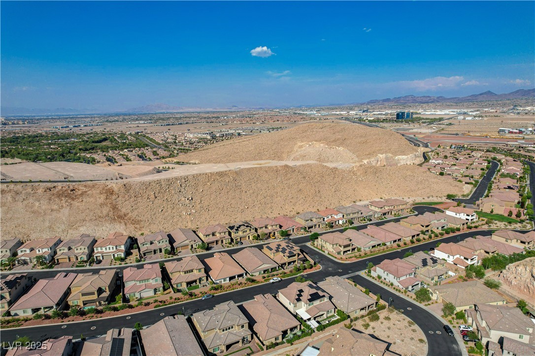 3943 Reyes Avenue Las Vegas, NV 89141 - Photo 70 of 93 Aerial overview of property's location with a mountain backdrop and nearby suburban area