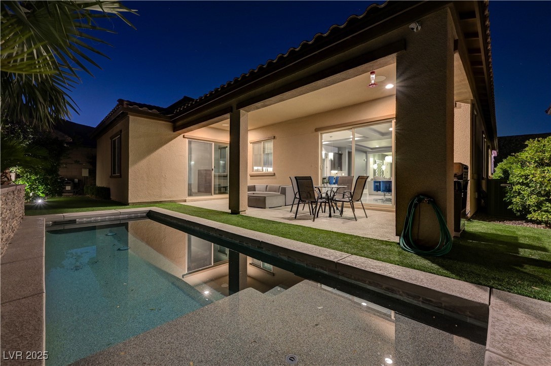 3943 Reyes Avenue Las Vegas, NV 89141 - Photo 90 of 93 Pool at twilight with an outdoor pool and a patio area
