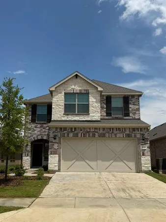 a front view of a house with yard