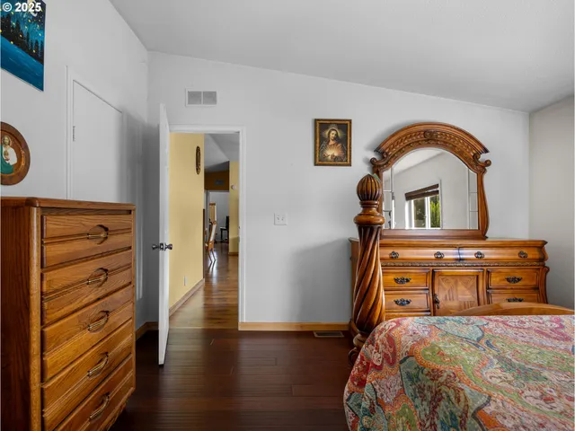 a bedroom with a bed and a dresser