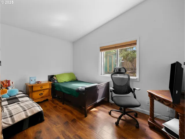 a bedroom with furniture and a window