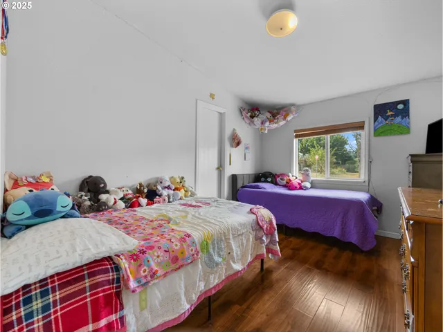 a bedroom with bed and a window