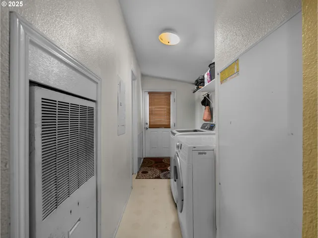 a kitchen with a refrigerator and a stove