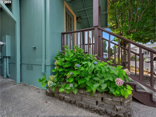 a view of a garden from a balcony
