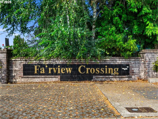 a street sign that is sitting on a brick wall
