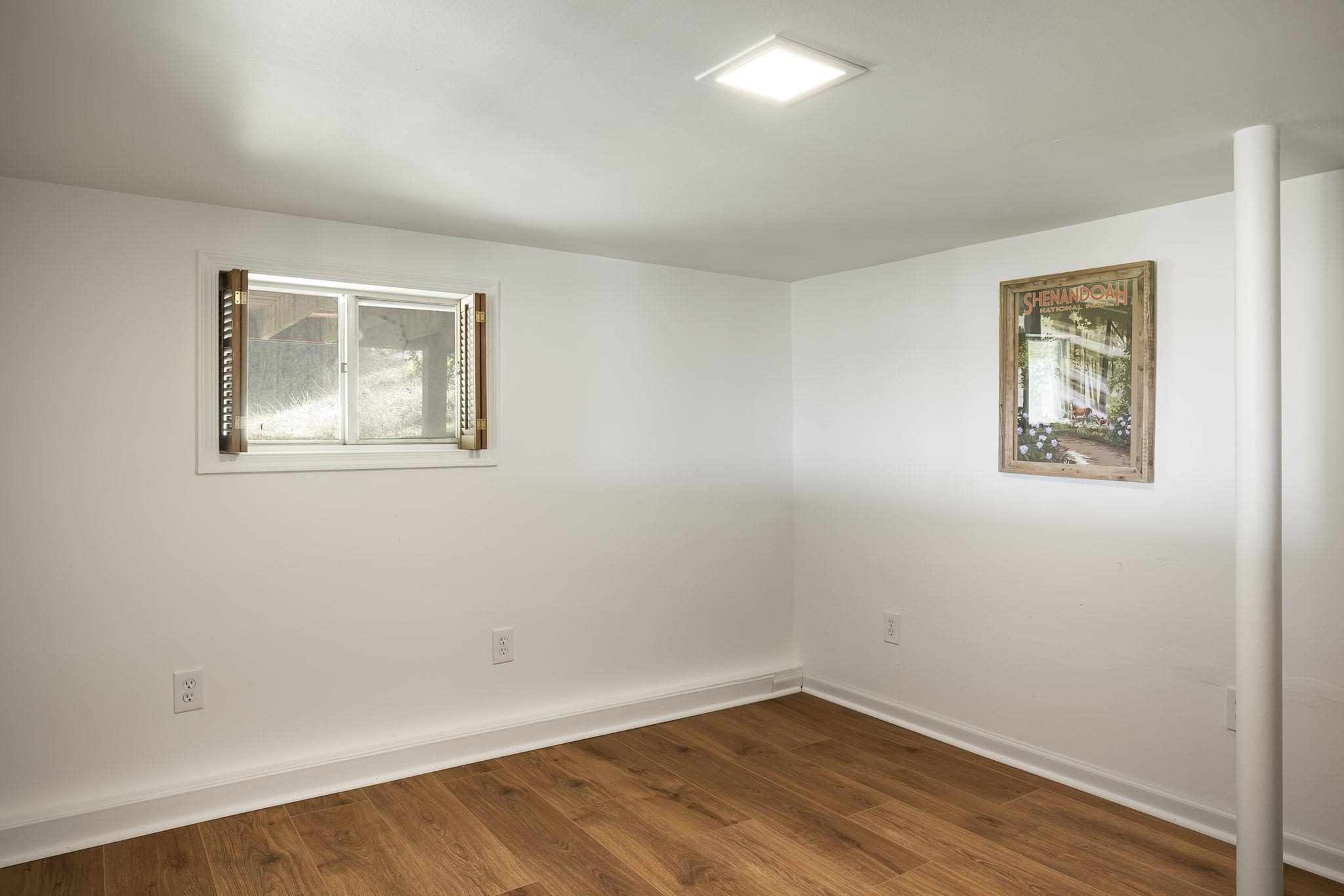 289 High View Drive Rileyville, VA 22650 - Photo 19 of 31 a view of an empty room with wooden floor and a window