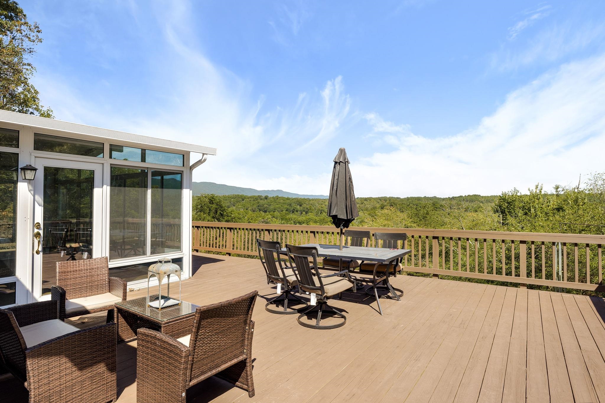 289 High View Drive Rileyville, VA 22650 - Photo 3 of 31 a roof deck with table and chairs