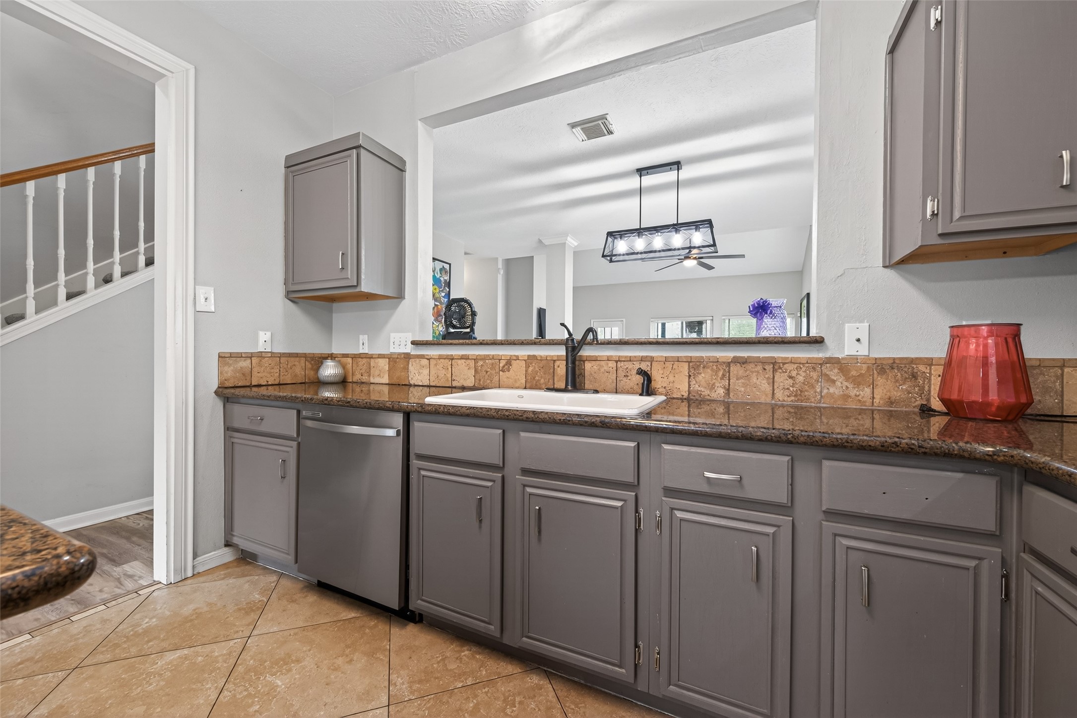 16902 Canyon Ridge Drive Spring, TX 77379 - Photo 12 of 43 a kitchen with kitchen island granite countertop a sink stainless steel appliances and cabinets