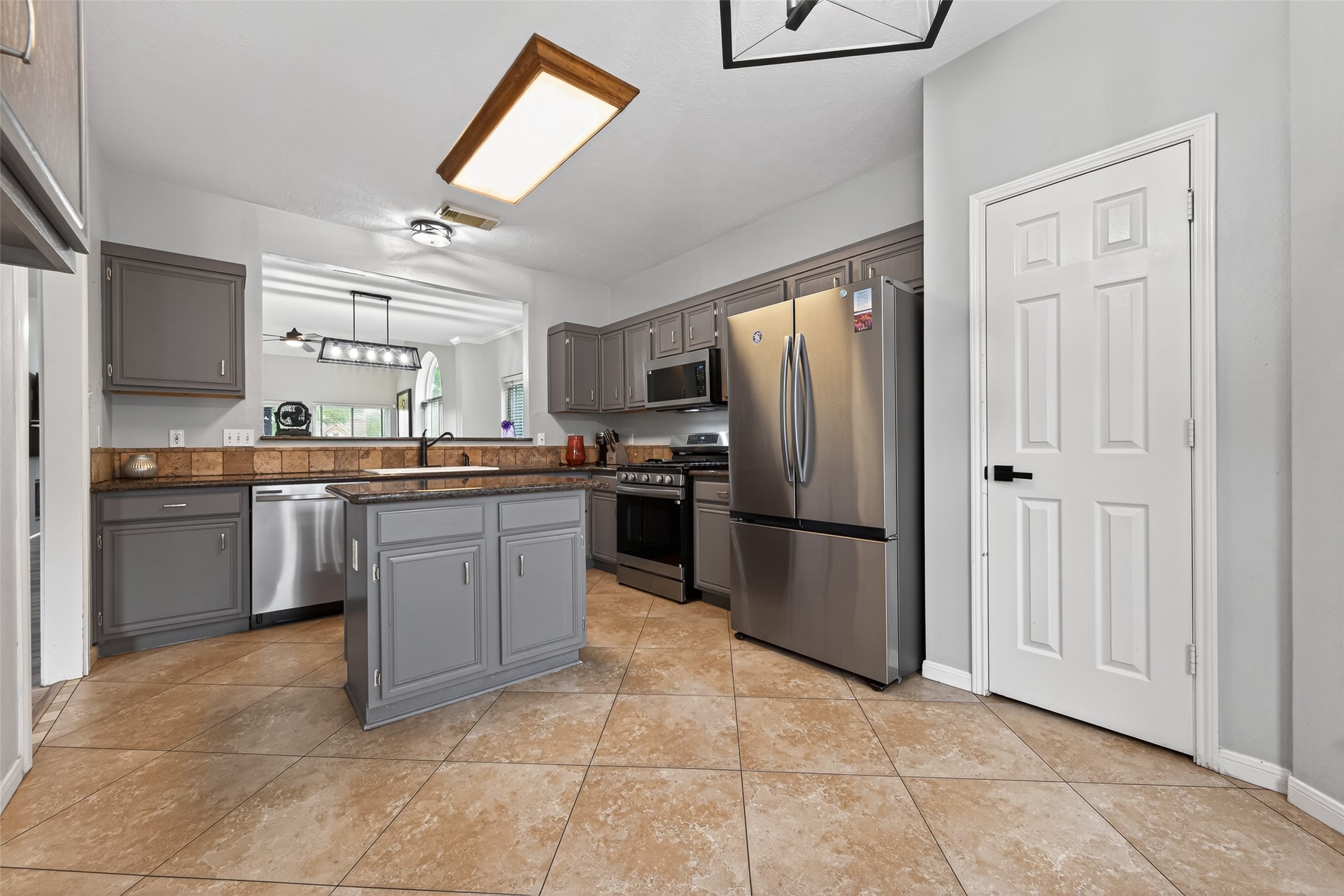 16902 Canyon Ridge Drive Spring, TX 77379 - Photo 15 of 43 a kitchen with stainless steel appliances granite countertop a refrigerator sink and cabinets